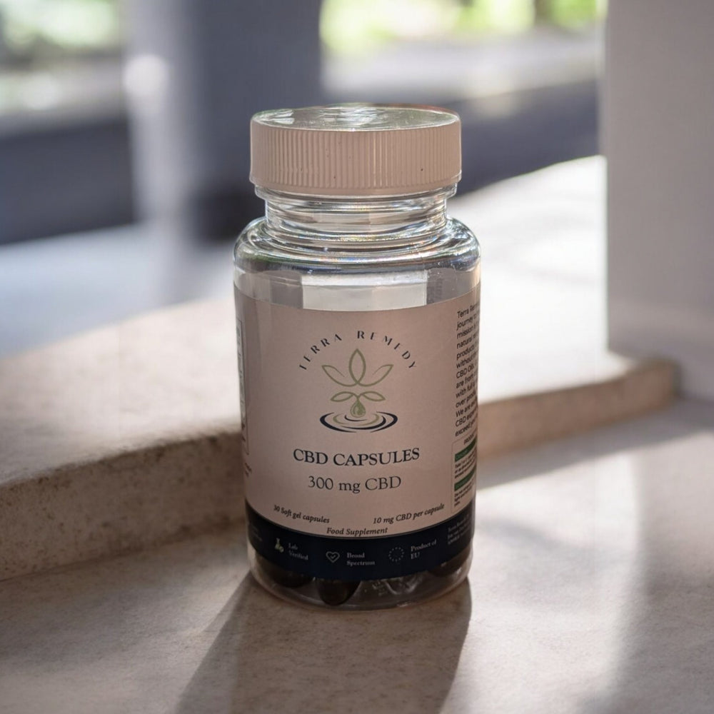 A bottle of Terra Remedy CBD Capsules, containing 300mg CBD oil with 30 soft gel capsules, displayed on a light-colored surface.