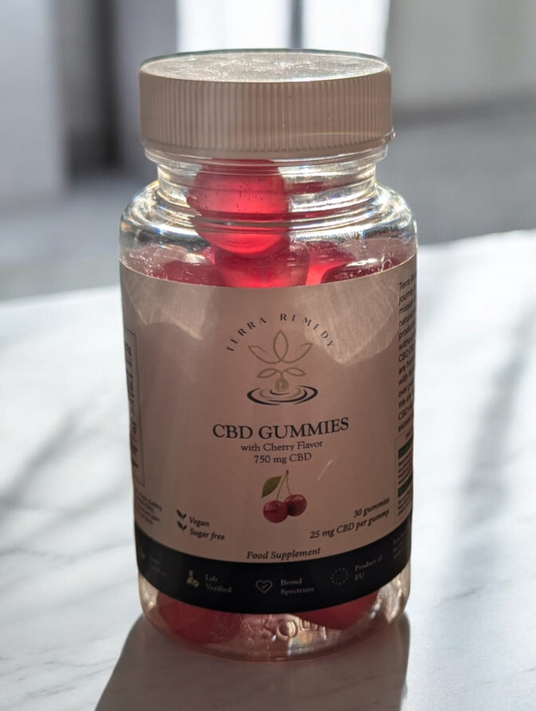 
                  
                    A bottle of Terra Remedy Cherry Flavor CBD Gummies, containing 750mg CBD with 30 gummies, displayed on a reflective surface.
                  
                