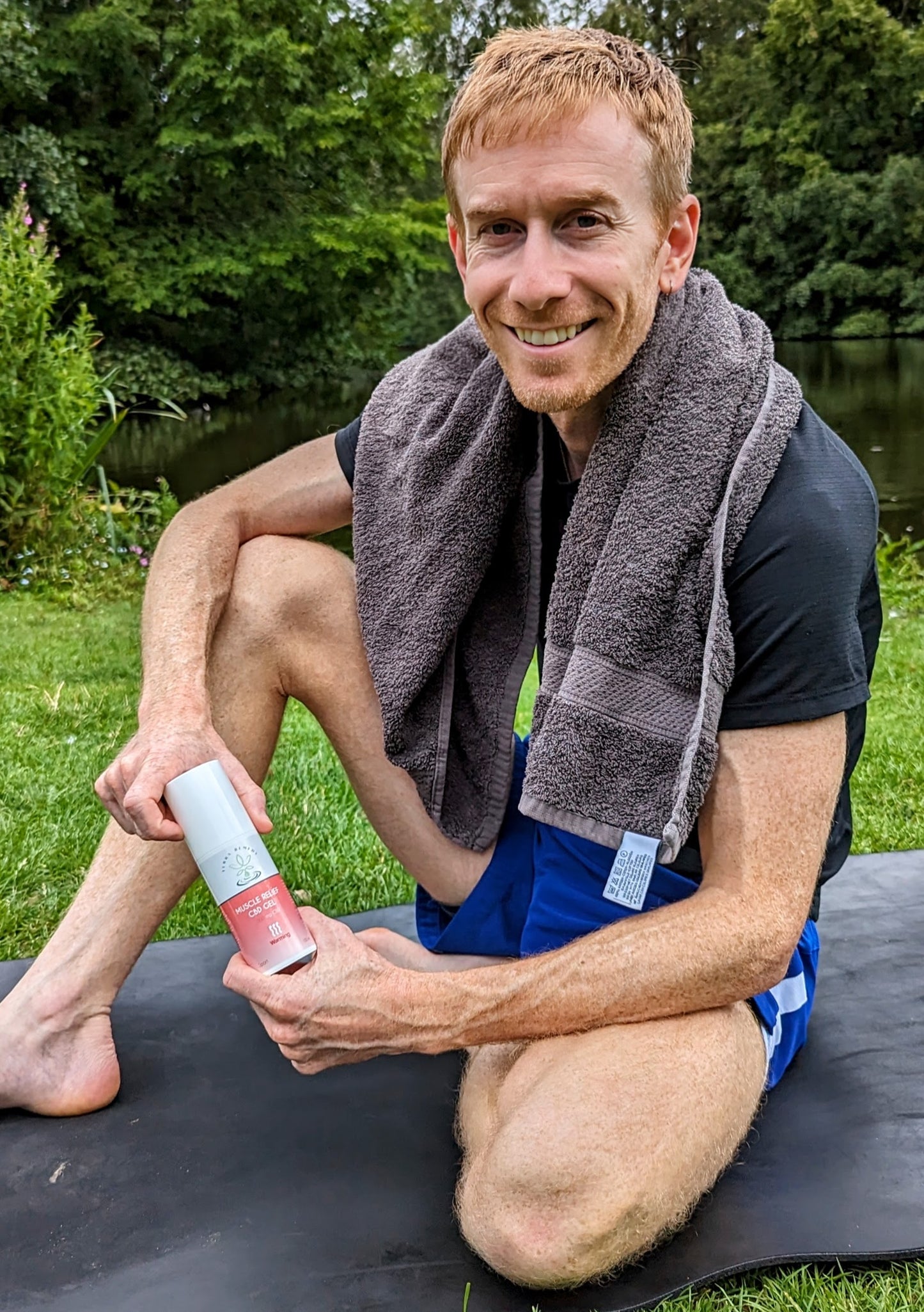 
                  
                    A person post-workout, smiling and holding Terra Remedy Muscle Relief Warming CBD Gel. The gel, with 500 mg of CBD, provides a warming effect for relieving muscle soreness and aiding recovery.
                  
                